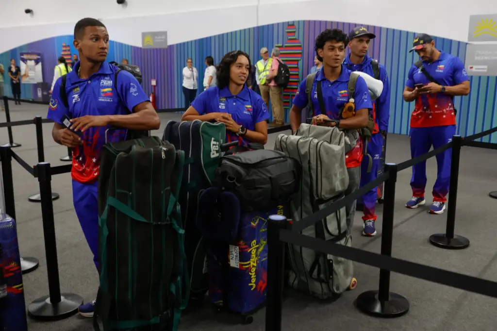 Passengers wait to check in at Simon Bolivar International Airport...