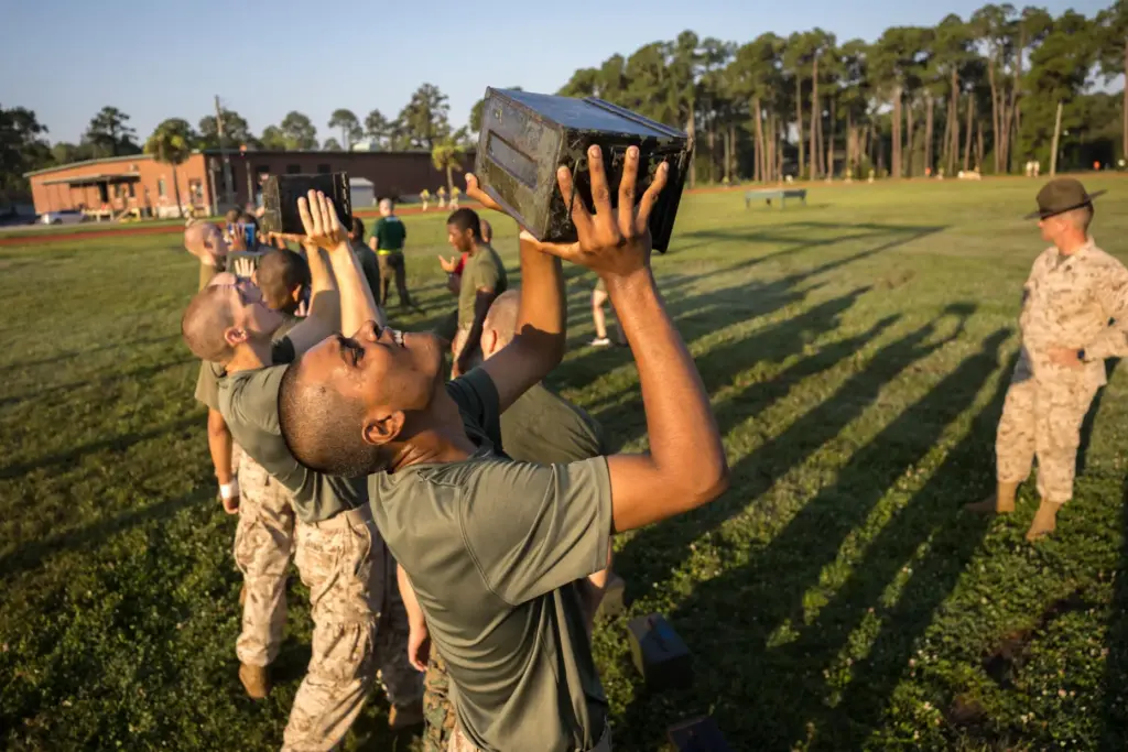 FILE – A group of U.S. Marine Corps recruits train...