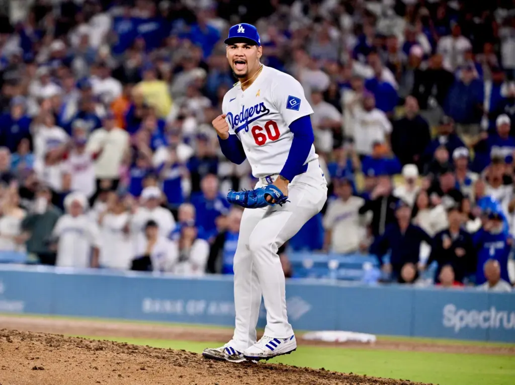 Dodgers relief pitcher Edgardo Henriquez strikes out Washington Nationals shortstop...