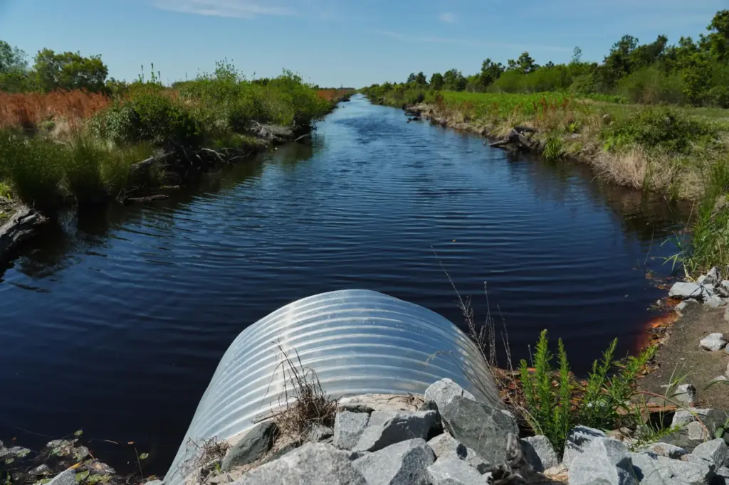Water fills an irrigation ditch with repaired drainage structures Tuesday,...
