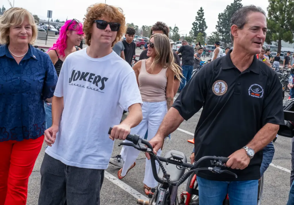 Orange County Council member Katrin Foley watches as Jesse Hayes...