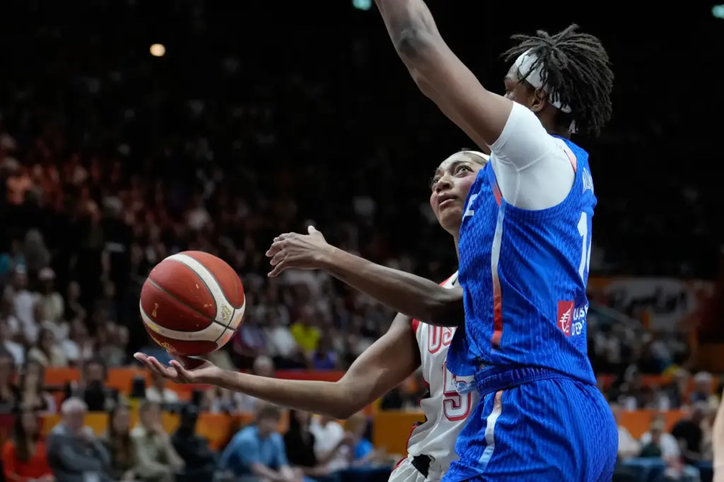 France’s Dominique Malonga guards Team USA forward Angel Reese during...