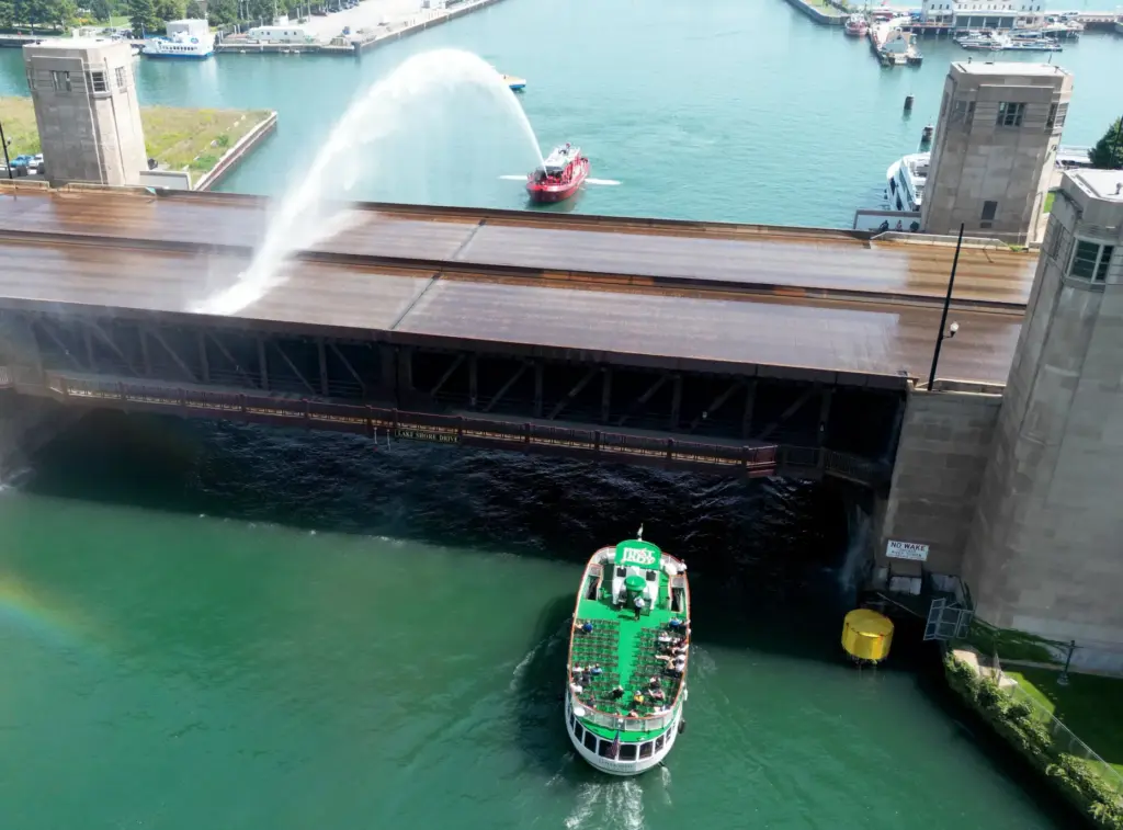 A Chicago Fire Department boat sprays water on the stuck...