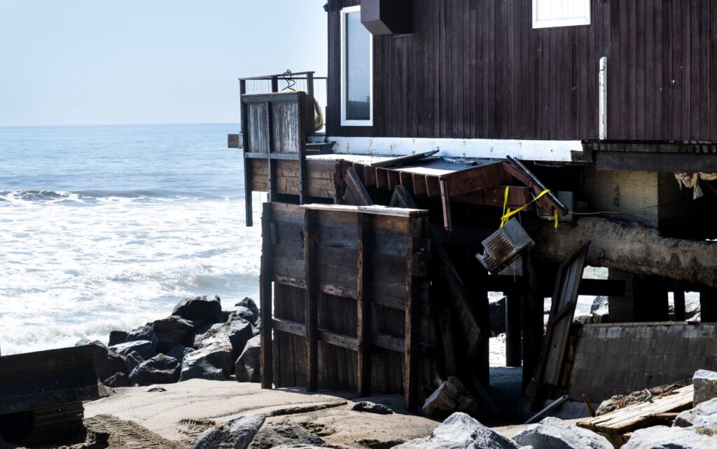 Boulders were being moved into place to protect homes along...