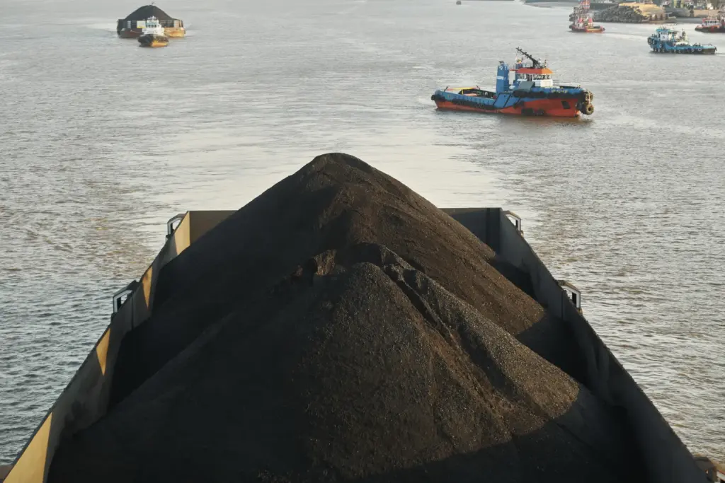A barge is fully loaded with coal on the Mahakam River in Samarinda, East Kalimantan, Indonesia.