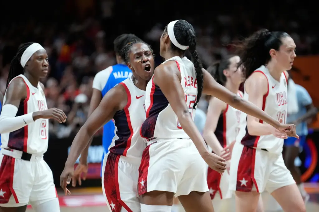 Team USA’s Chelsea Gray, left, and Angel Reese celebrate during...