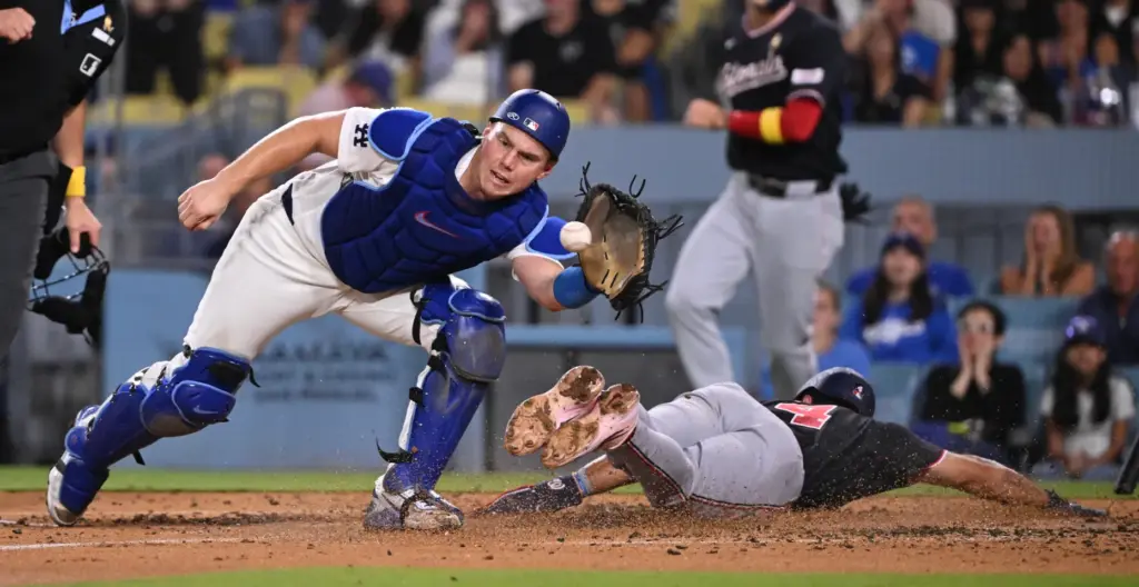 Washington Nationals outfielder Daylen Lile scores past Dodgers catcher Will...