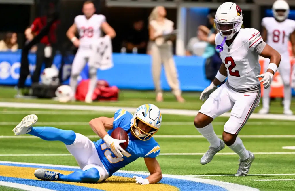Chargers wide receiver Ladd McConkey (15) catches a pass for...