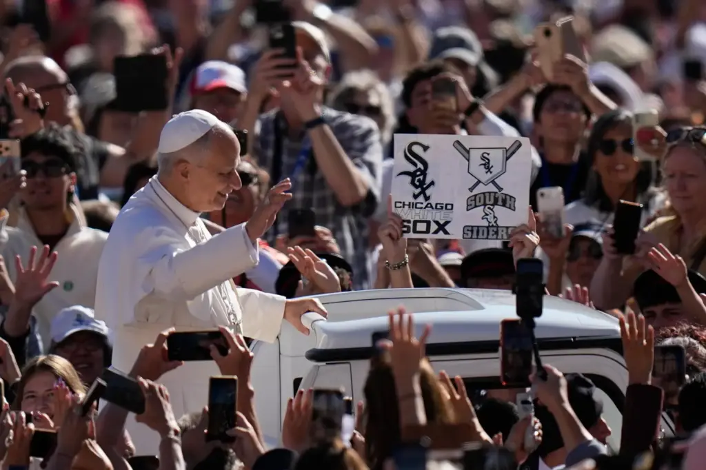 A Chicago White Sox supporter shows a banner as Pope Leo XIV arrives.