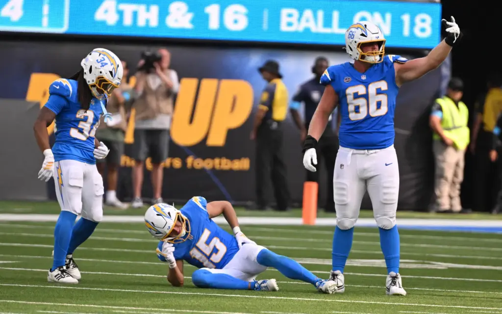 Chargers wide receiver Ladd McConkey (15) is injured on a...