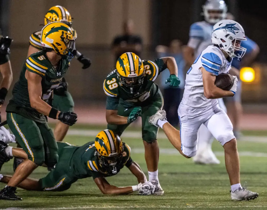 Corona del Mar running back Holden Perisi (32) carries the...