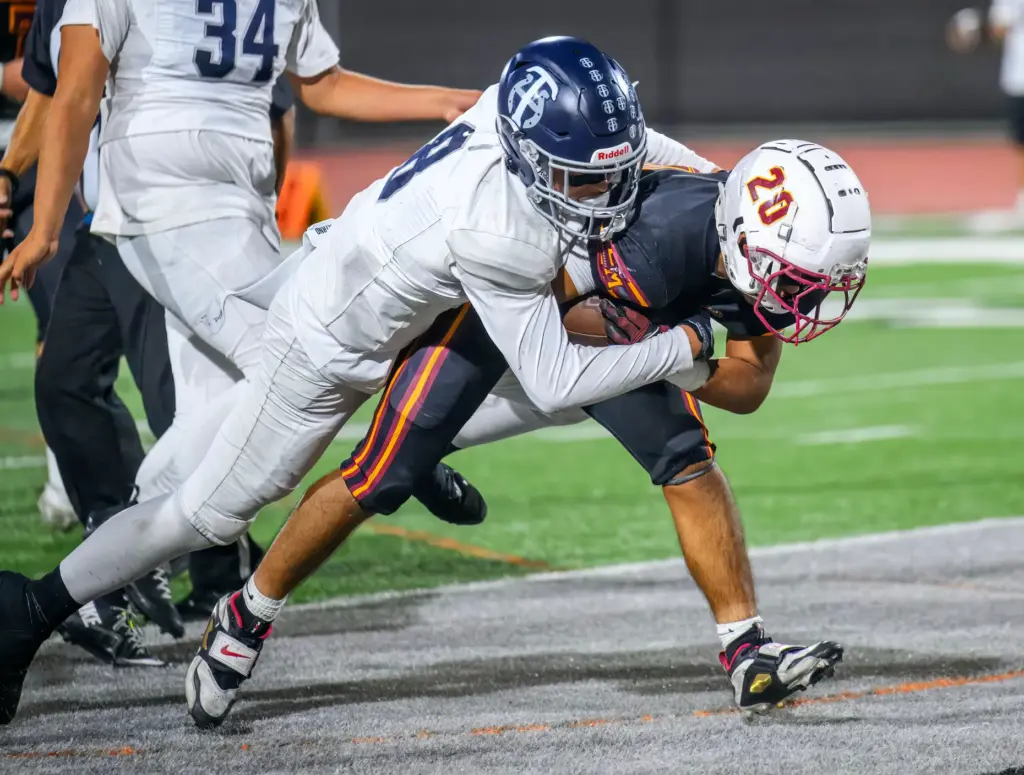 El Modena’s Nathan de la Vega pulls along Trabuco Hills...