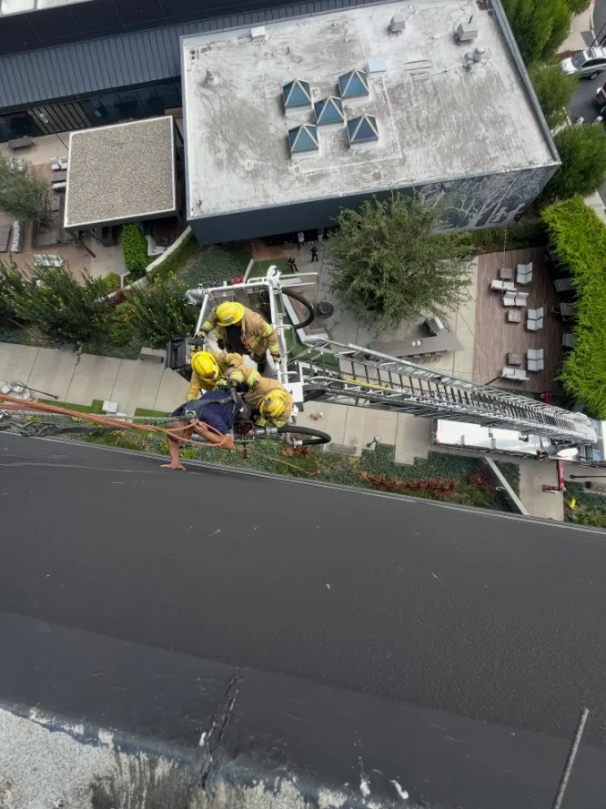 Firefighters rescued a window washer who was stranded about 60...