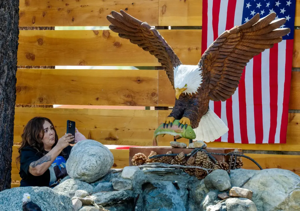 Gina De La Rosa records the life-size Jackie carving unveiled...