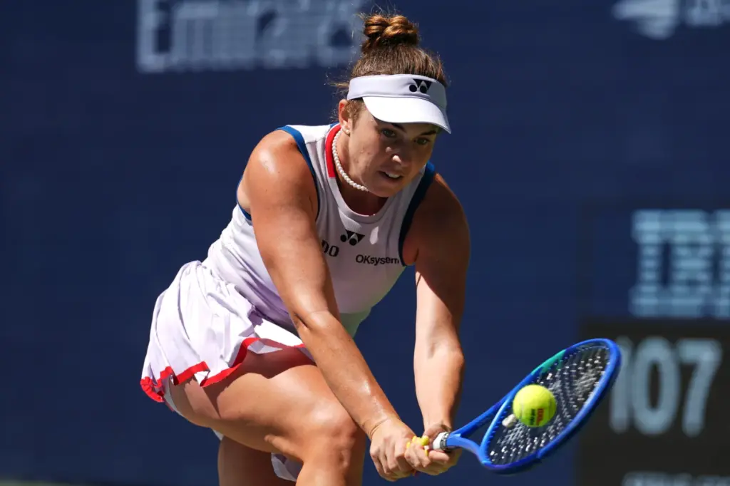 Linda Noskova, of the Czech Republic, returns the ball to...
