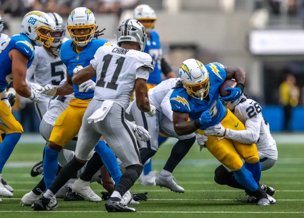 Chargers running back Omarion Hampton (8) carries the ball during...
