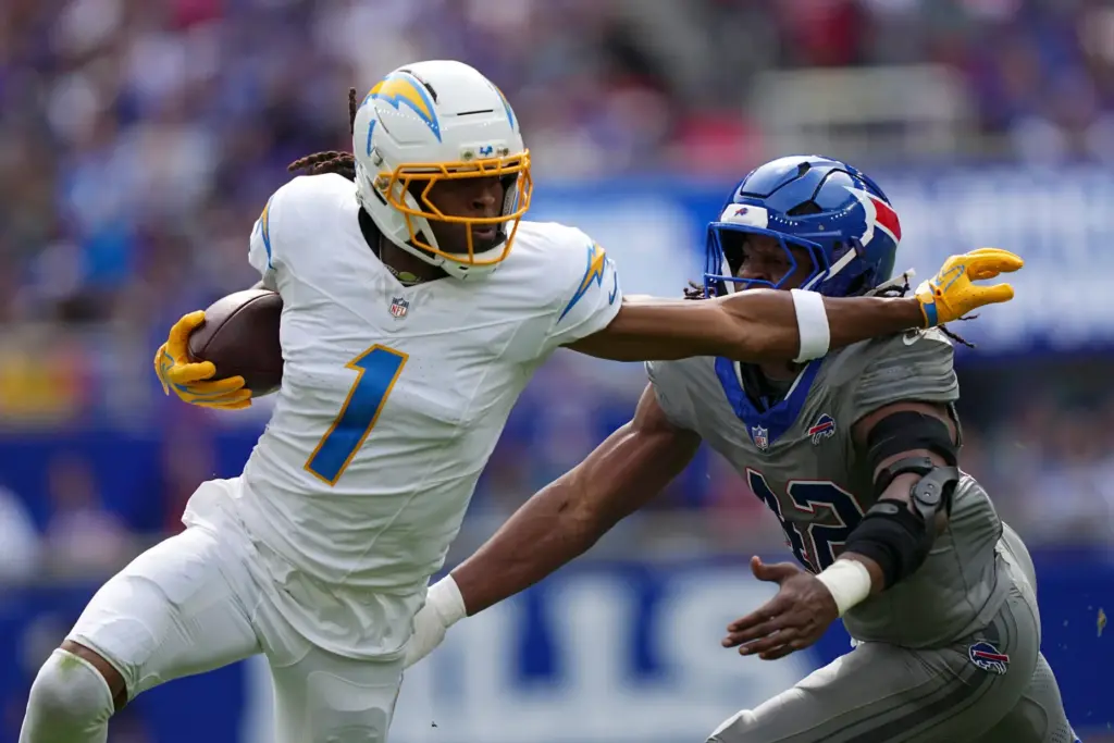 Chargers wide receiver Quentin Johnston (1) runs from Buffalo Bills...
