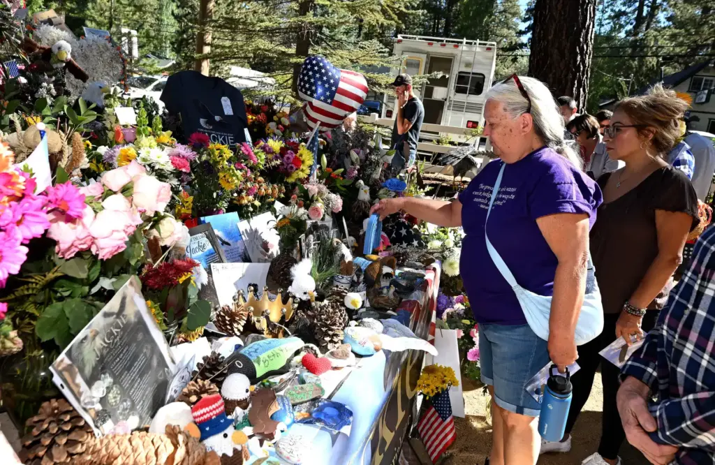 Linda Seitz, from Big Bear, leaves an item at a...