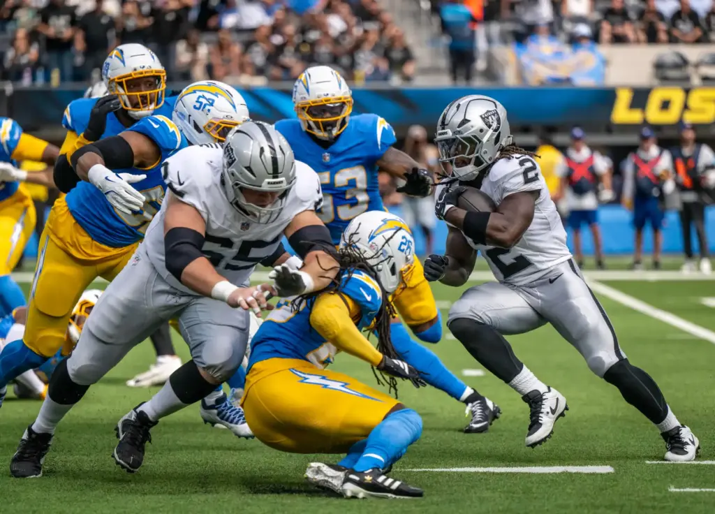 Raiders running back Ashton Jeanty (2) carries the ball during...