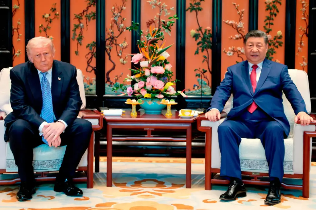 FILE – Chinese President Xi Jinping, right, and President Donald...