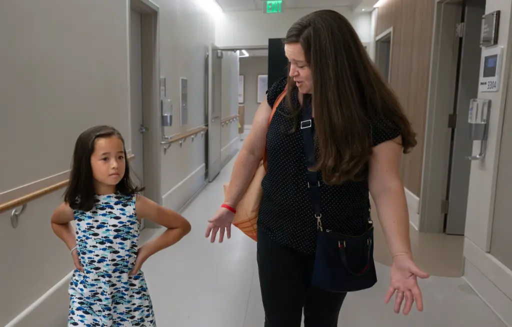 Brooke Park and her 9-year-old daughter, Audrey, tour the new...