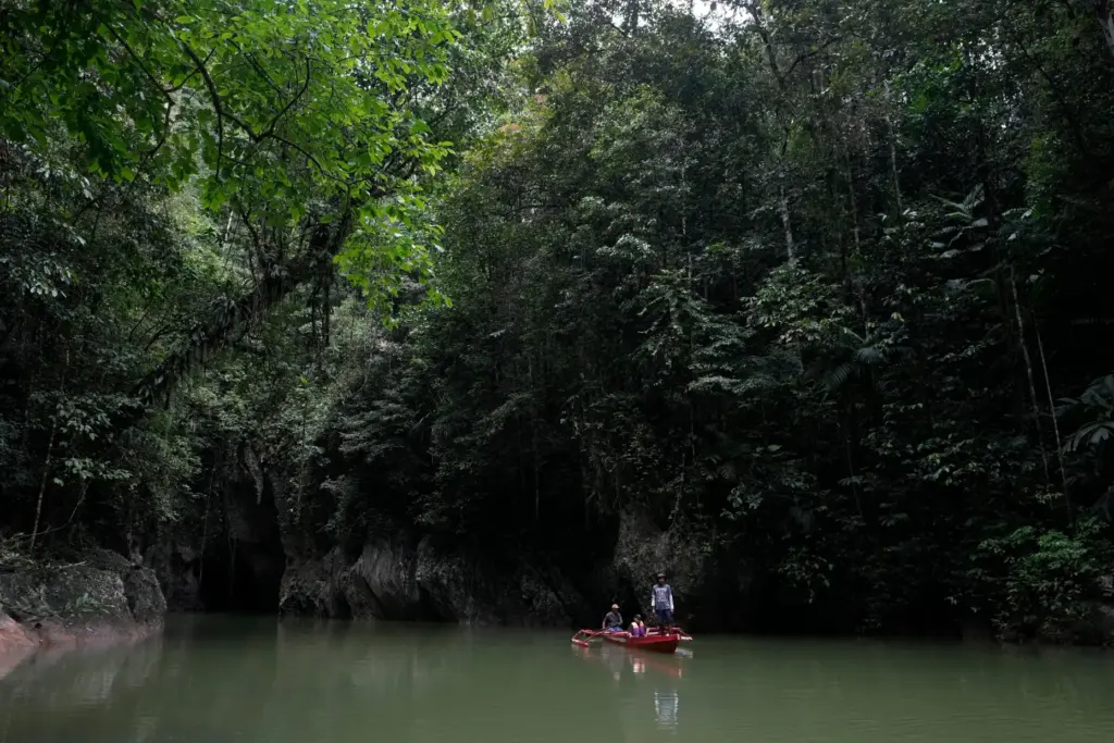 FILE – Men on a boat maneuver near the Bokimaruru...