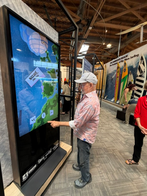 Filmmaker Greg MacGillivray checks out the interactive “Stoke Machine” at...