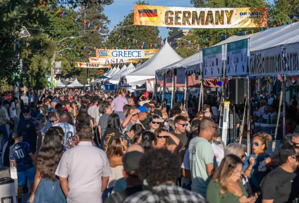 Thousands of fairgoers fill Chapman Avenue in Downtown Orange as...