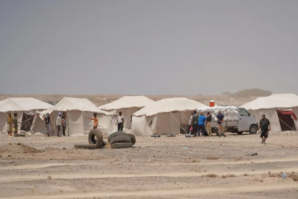 Displaced Yemenis are seen at Al-Firdaws camp in Ras Imran.