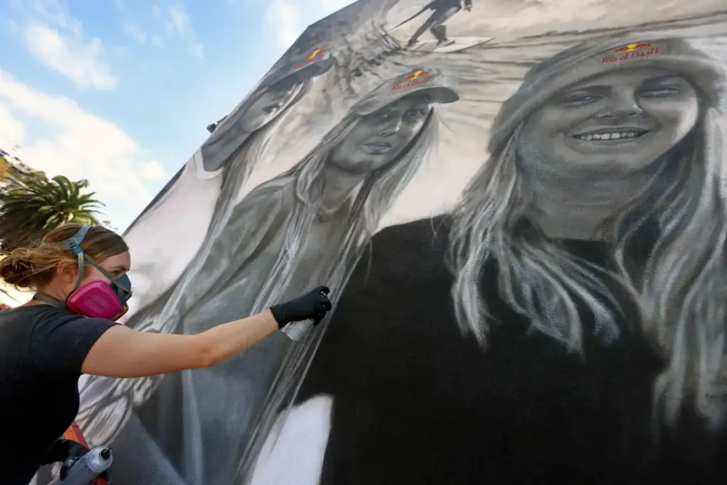 Artist Julie Engelmann of Half Moon Bay paints a mural...