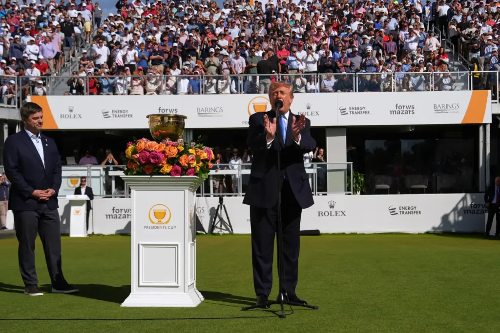 President Donald Trump speaks as PGA Tour CEO Brian Rolapp...
