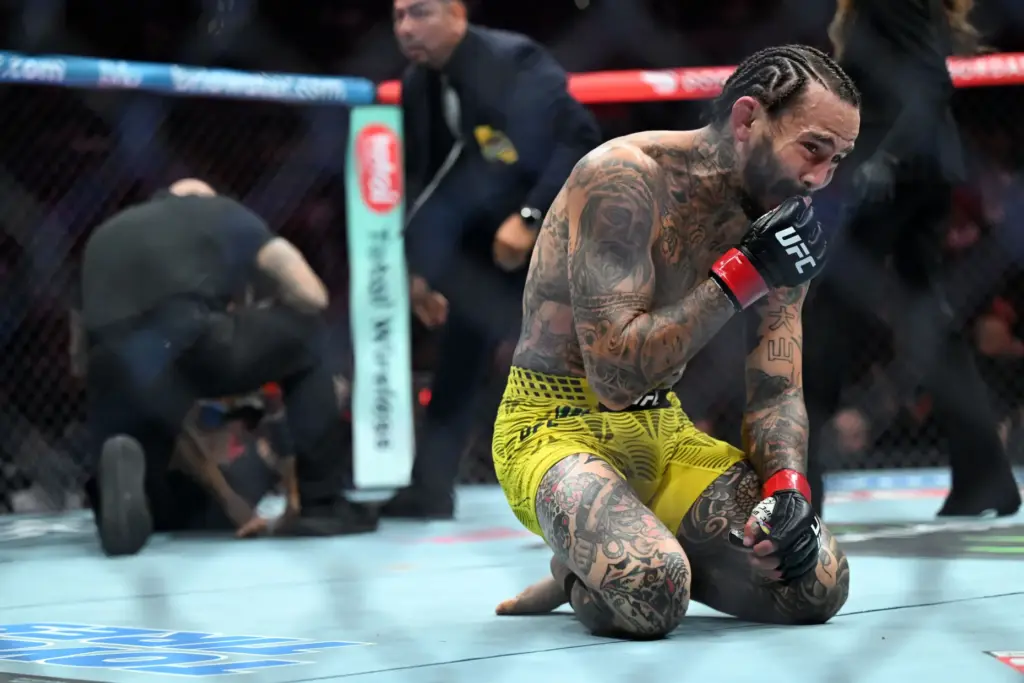 Marlon Vera (red) takes a moment after defeating Charles Jourdain...
