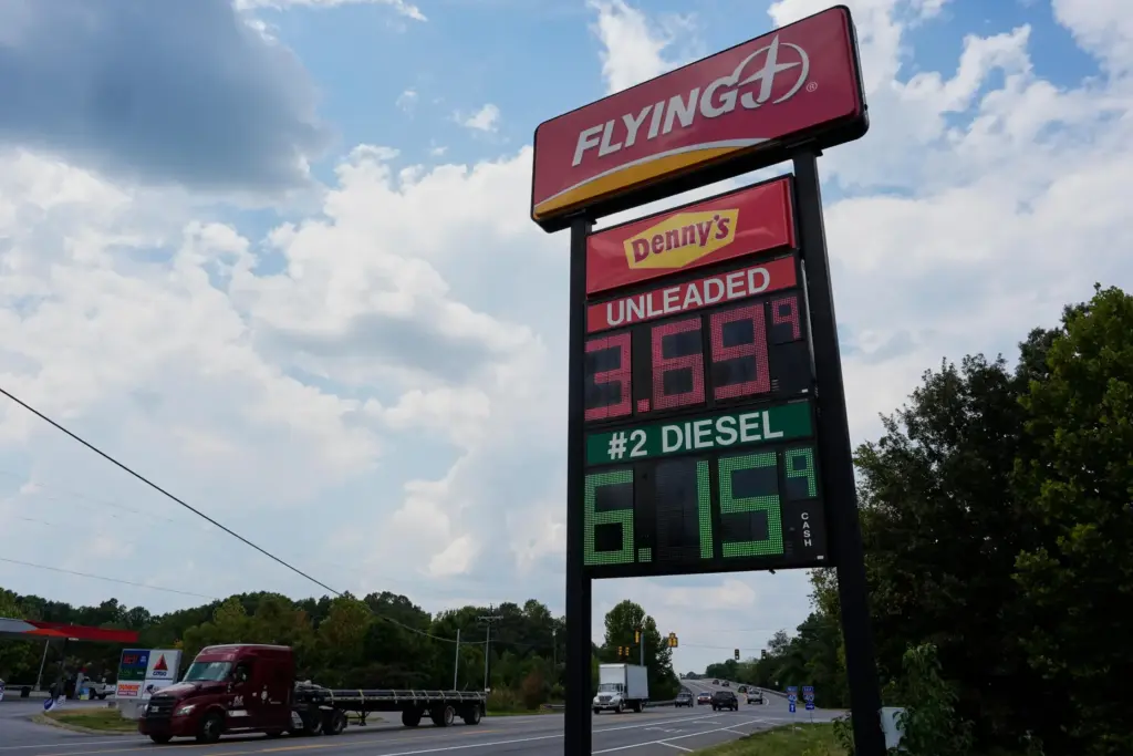 Fuel prices are displayed outside a truck stop Friday, Sept....