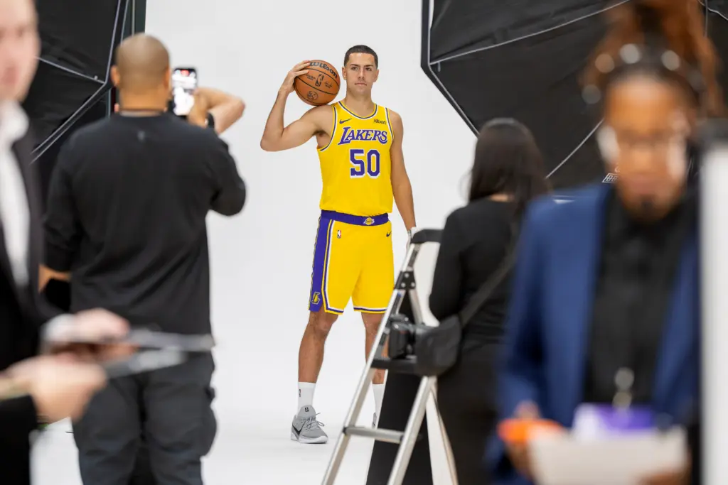 Lakers guard Cole Swider poses for photographs during the team’s...