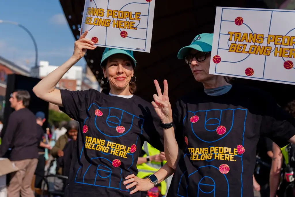 FILE – Demonstrators rally in support of transgender athletes in...