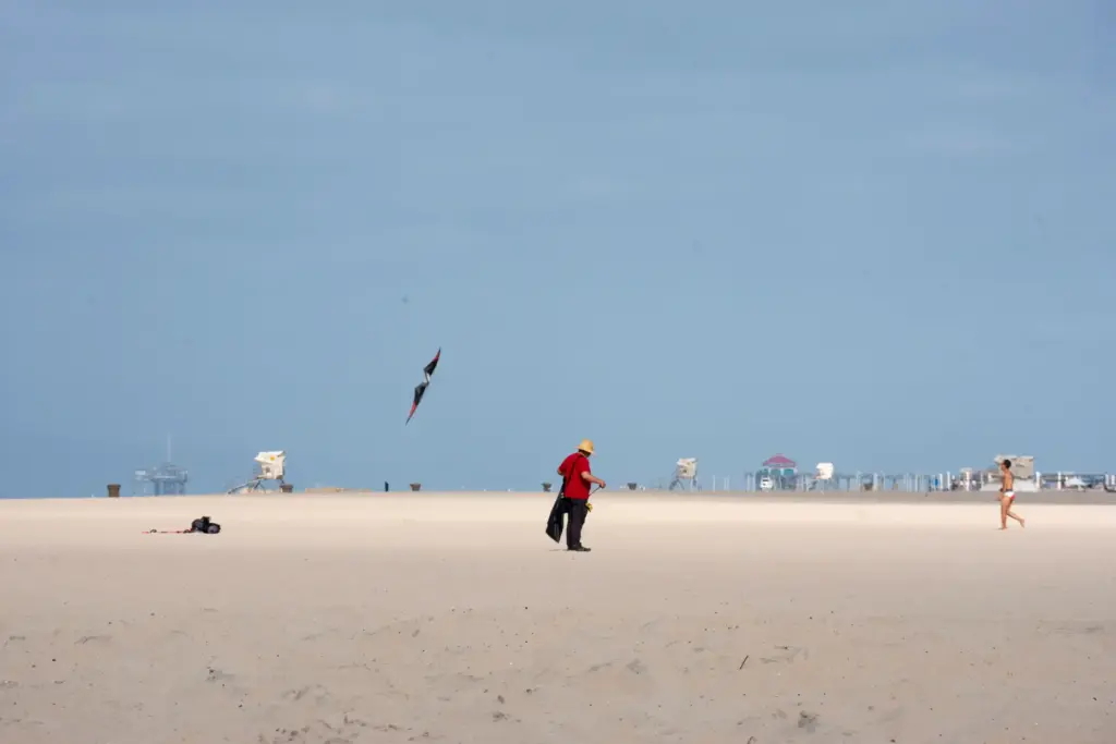 Hendy Kusumadilaga puts trash into his bag while on the...
