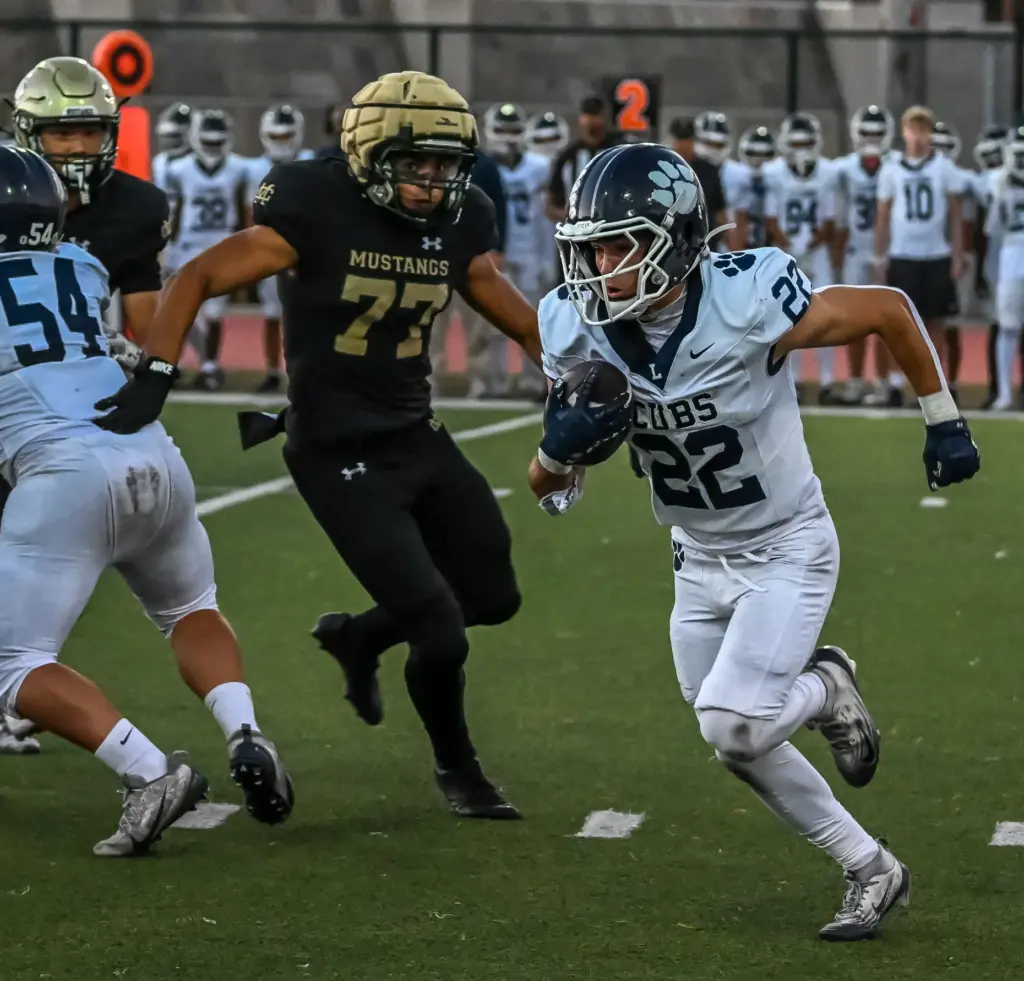 Loyola running back Matthew Fine rushes the ball during the...