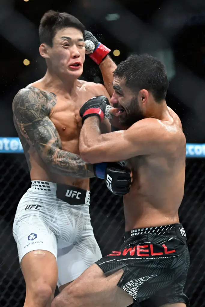 Michael Aswell Jr.(red) vs. Joosang Yoo (blue) during their fight...