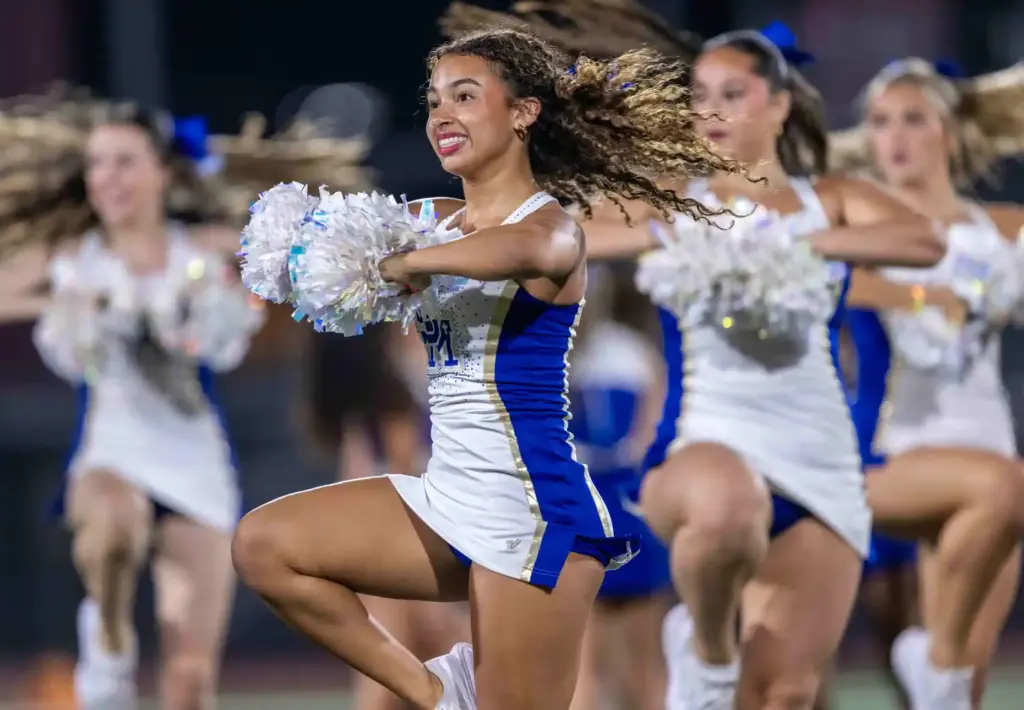Santa Margarita cheerleaders perform on the field during the halftime...