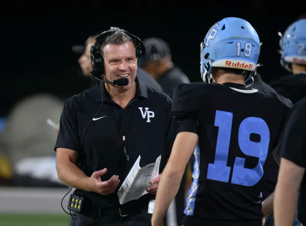 Villa Park head coach Dusan Ancich talks with one of...