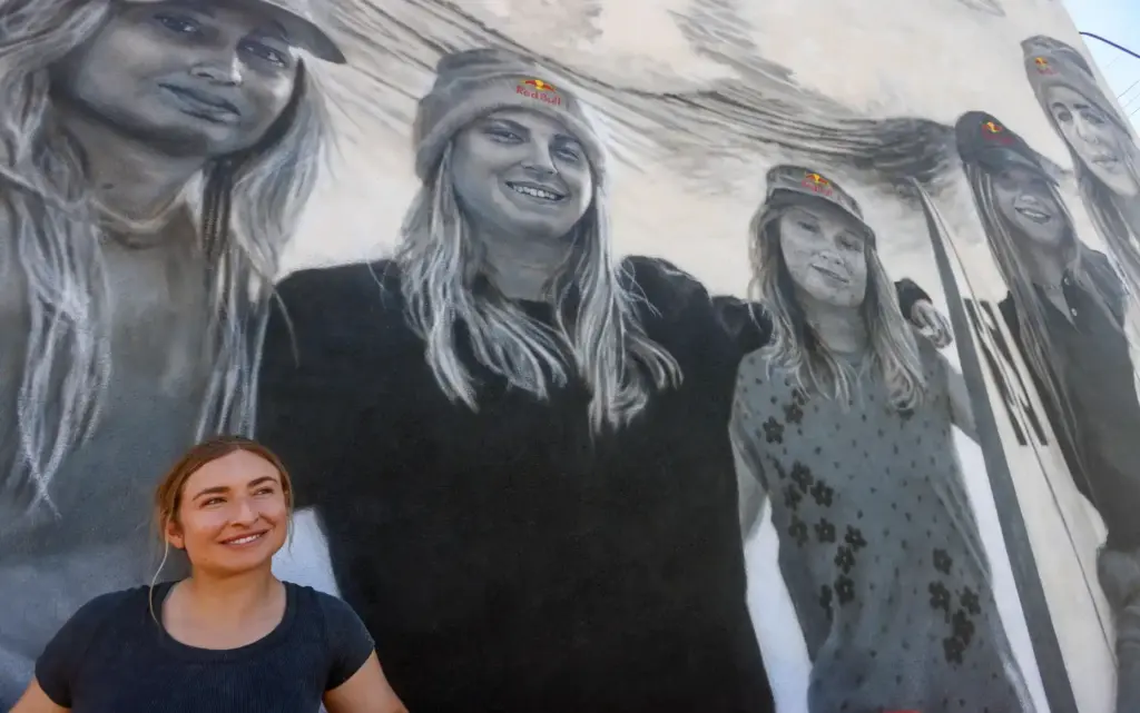 Artist Julie Engelmann of Half Moon Bay paints a mural...