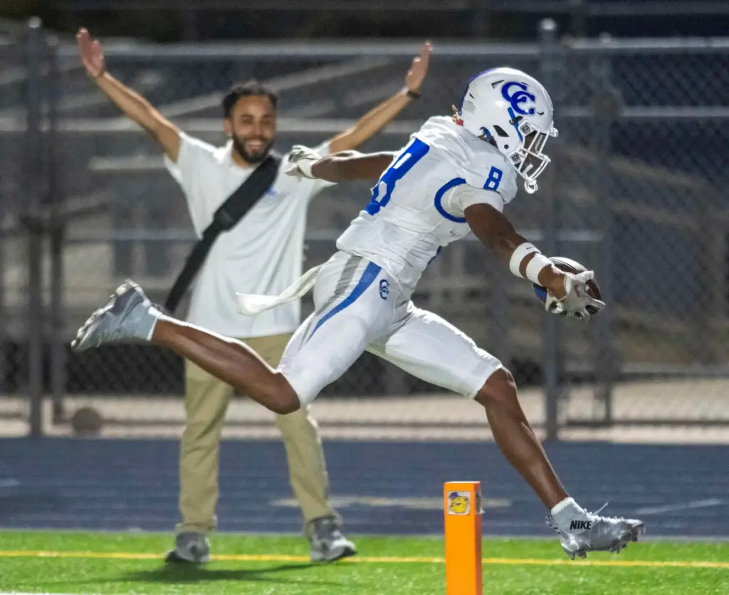 Culver City’s Jo’el la Foe (8) scores his first touchdown...