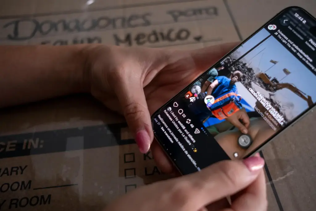 Dariela Merchan, a registered nurse, scrolls through the Instagram profile...