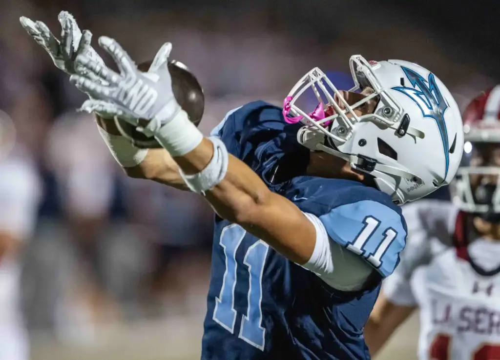 Corona del Mar wide receiver Henry Birchard (11) nearly comes...