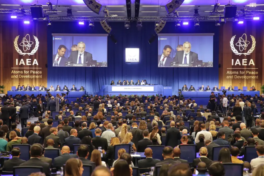 Delegates watch the IAEA Board of Governors.