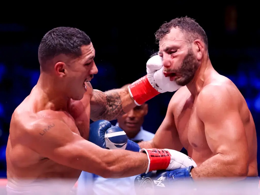 Jai Opetaia, left, punches Noel Mikaelian in their cruiserweight championship...