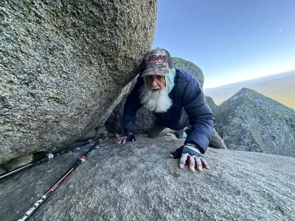 Dale Sanders, 91, climbs a section of Mt. Katahdin, Monday,...
