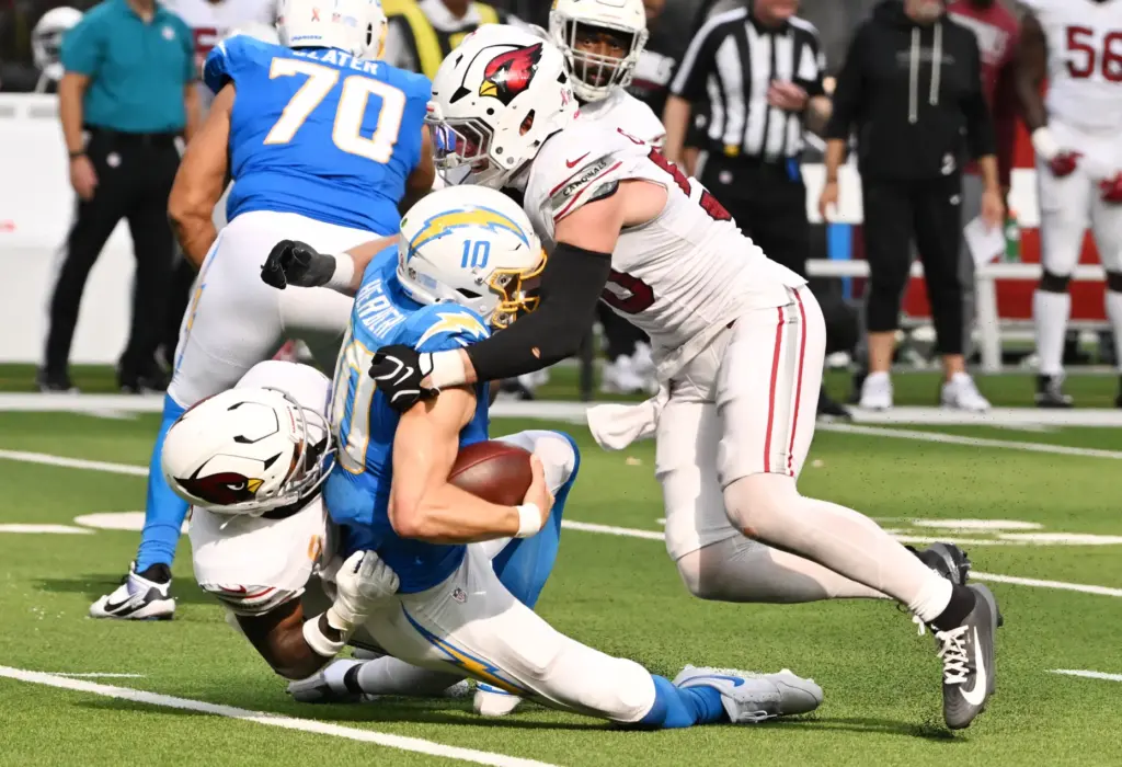 Chargers quarterback Justin Herbert (10) is sacked by Arizona Cardinals...