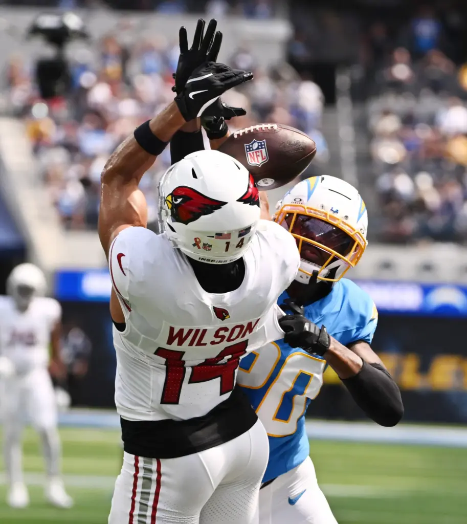 Chargers cornerback Cam Hart (20) knocks away a pass intended...