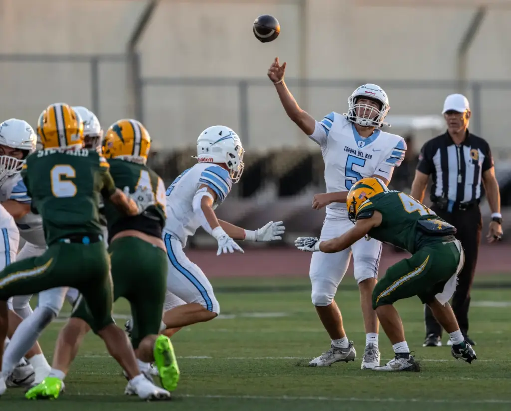 Corona del Mar quarterback Luca Dinapoli (5) throws the ball...